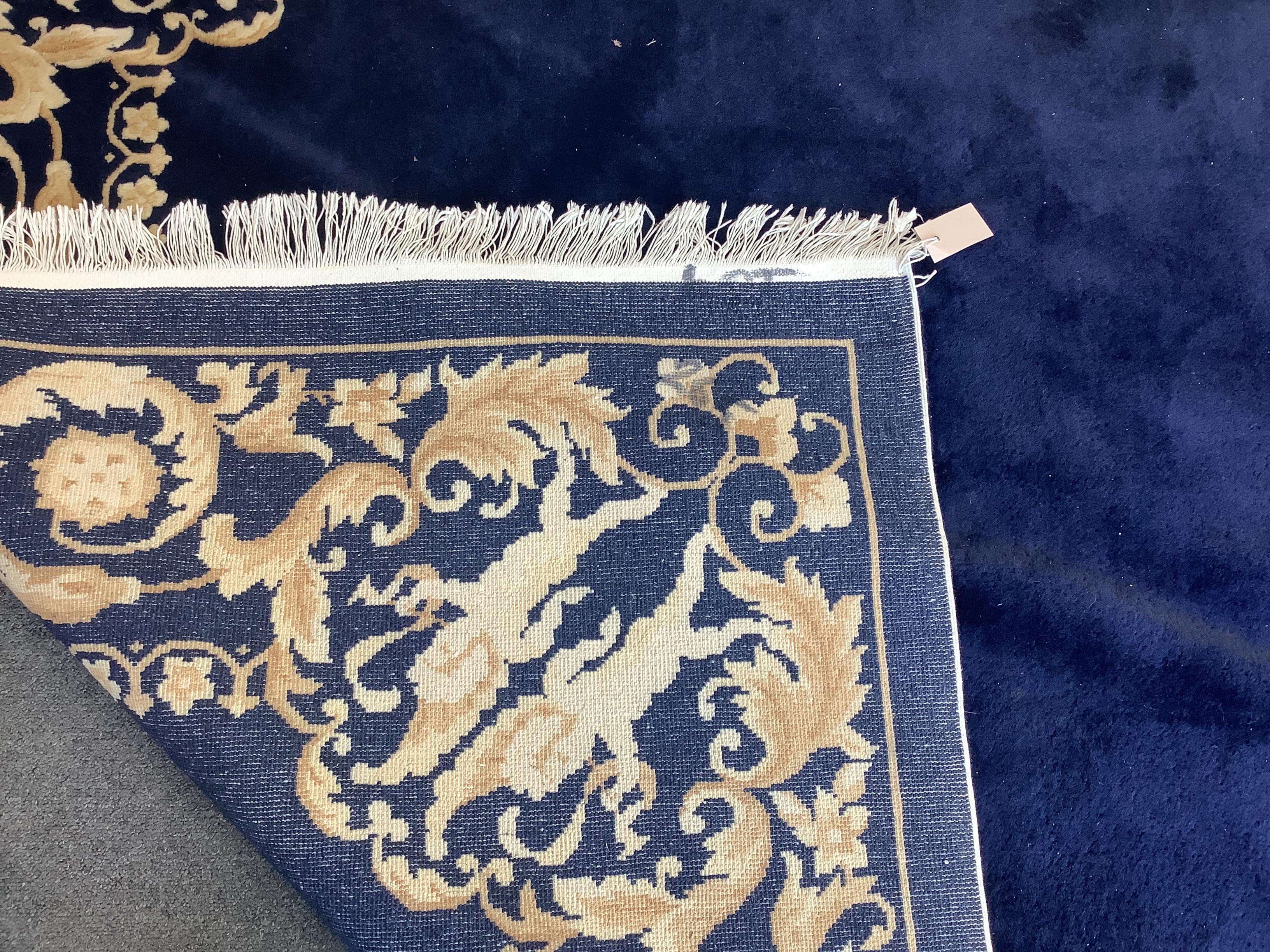 An Indian blue ground rug, 250 x 170cm
